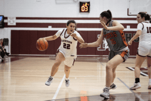 Mia Strazza drives against Addison Dorfman on Dec. 9.